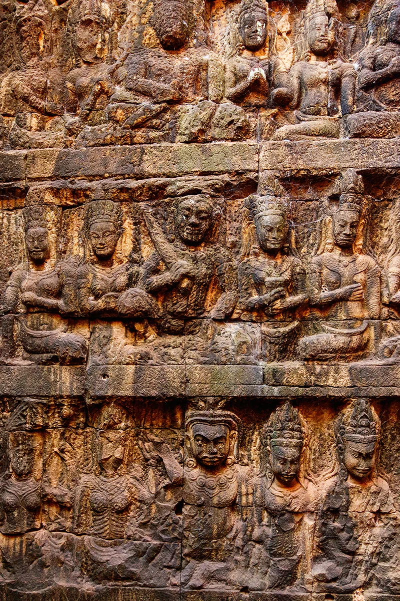 Walls of the Terrace of the Leper King in Angkor covered in well-preserved carvings