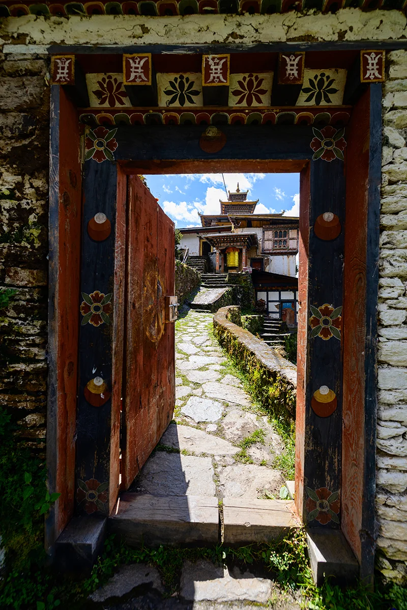 Open door to a serene Zangdok Pelri Temple in Bhutan