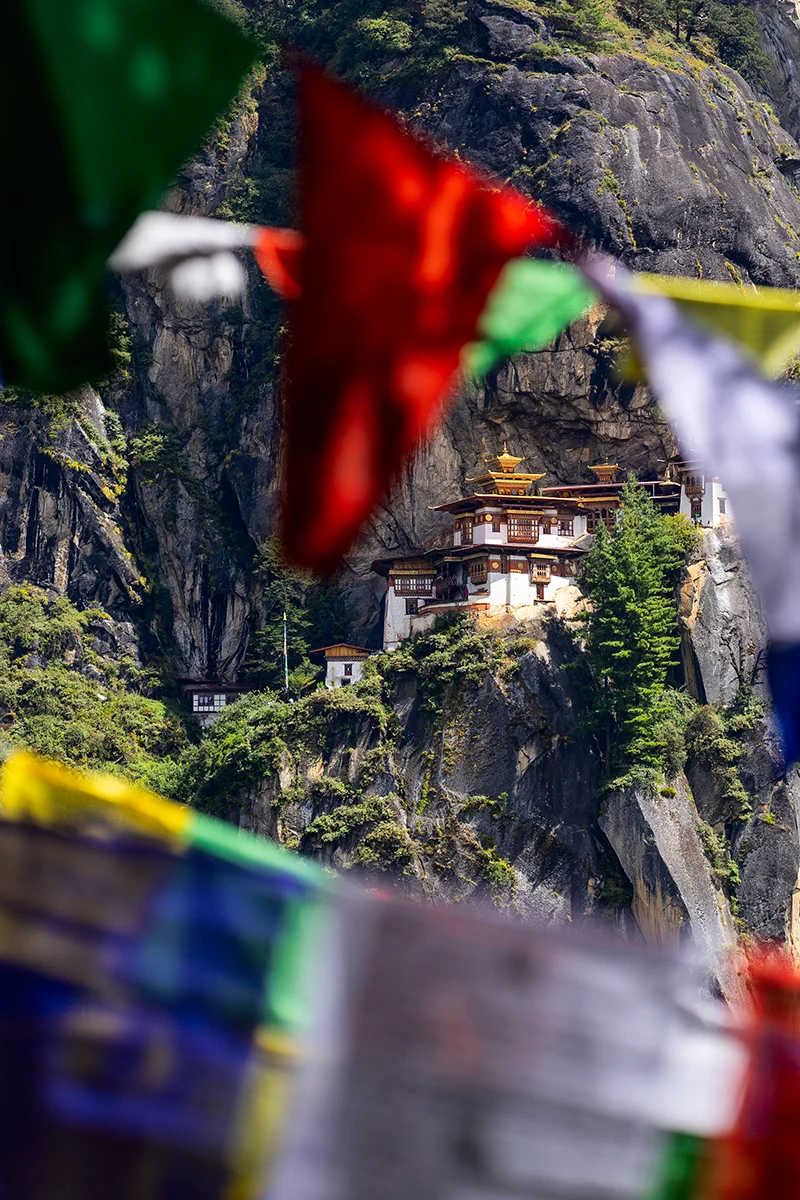 Tiger's Nest Monastery perched on a cliff and prayer flags